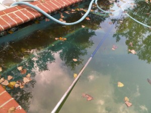 Should I vac my swimming pool before closing?