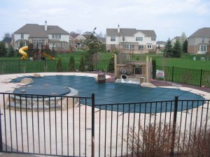 Safety Cover by Merlin installed by Legendayr Escapes on a Canton vinyl liner pool with raised spillover spa and waterfeature (8)