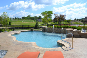 Water features, clean lines, and muted colors give this entertainment area a casual, contemporary feel.